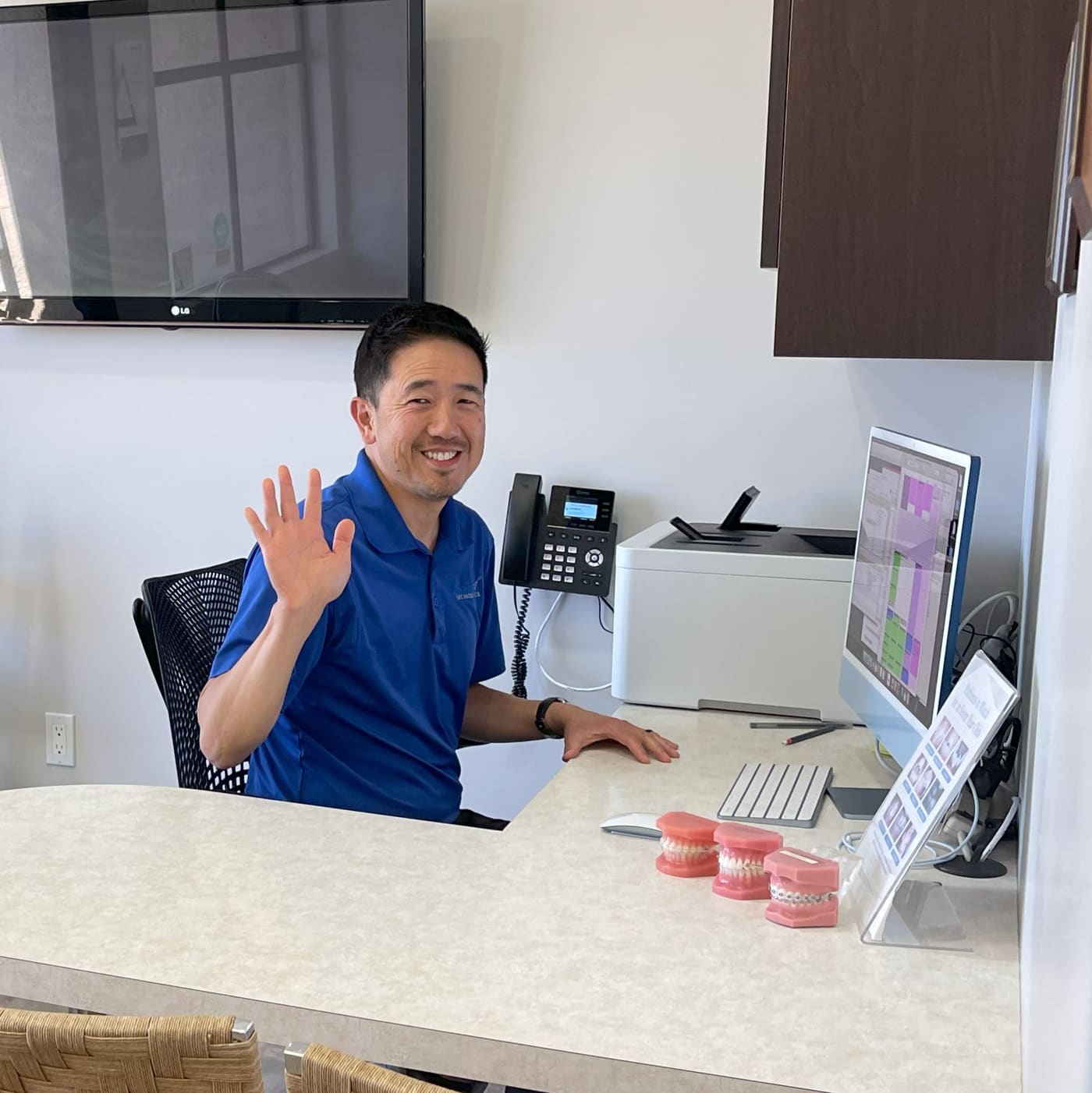 Dr. Chang at the consultation desk where treatment options and payment plans are explained